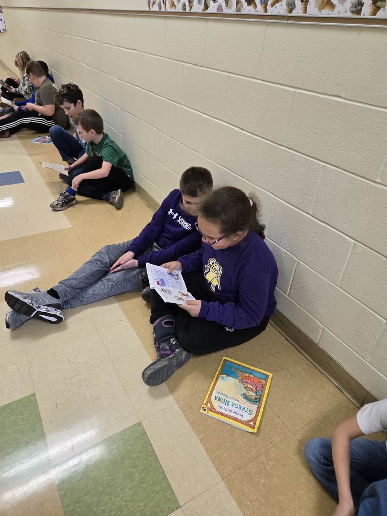 5th grader reading to 2nd grader