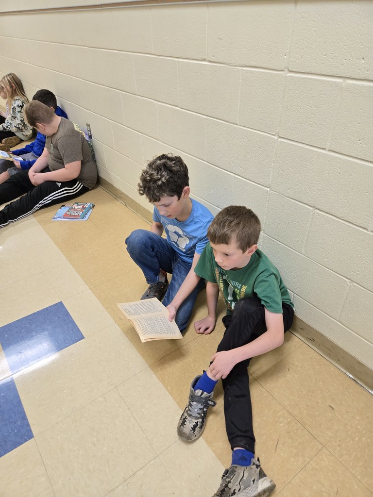 5th grader reading to 2nd grader