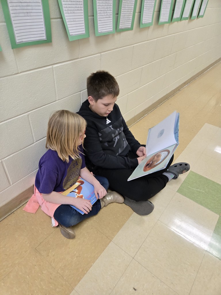 5th grader reading to 2nd grader