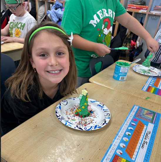 Ms. Daniels 3rd grade  students making Grinch houses