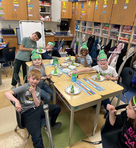 Ms. Daniels 3rd grade  students making Grinch houses