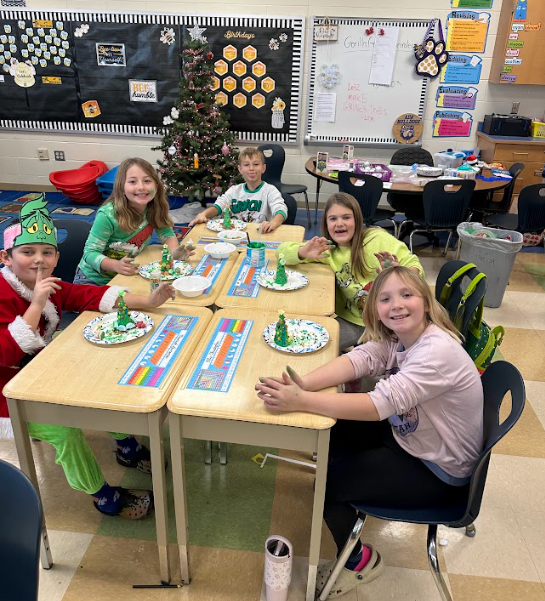 Ms. Daniels 3rd grade  students making Grinch houses