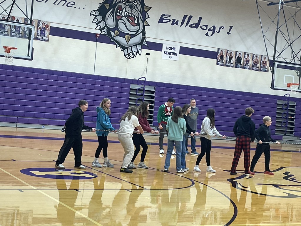 middle schoolers playing tug of war