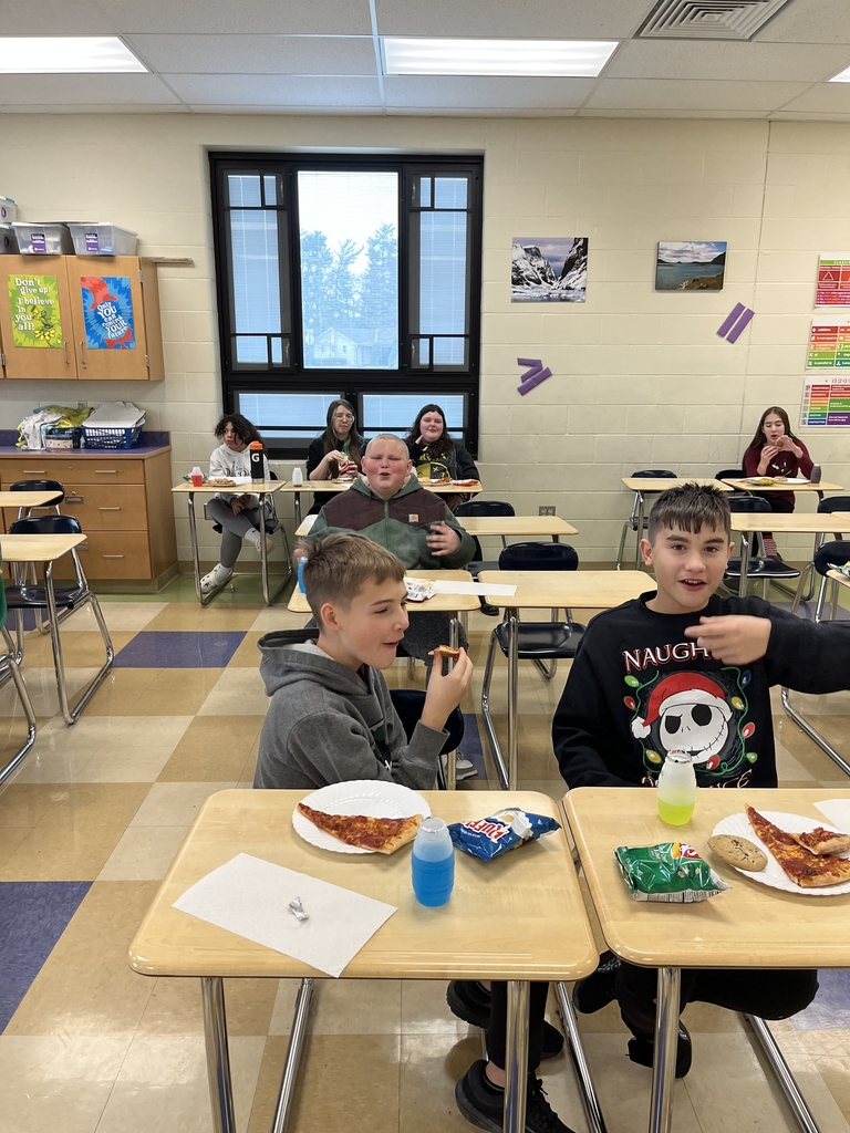 Students enjoying a pizza party