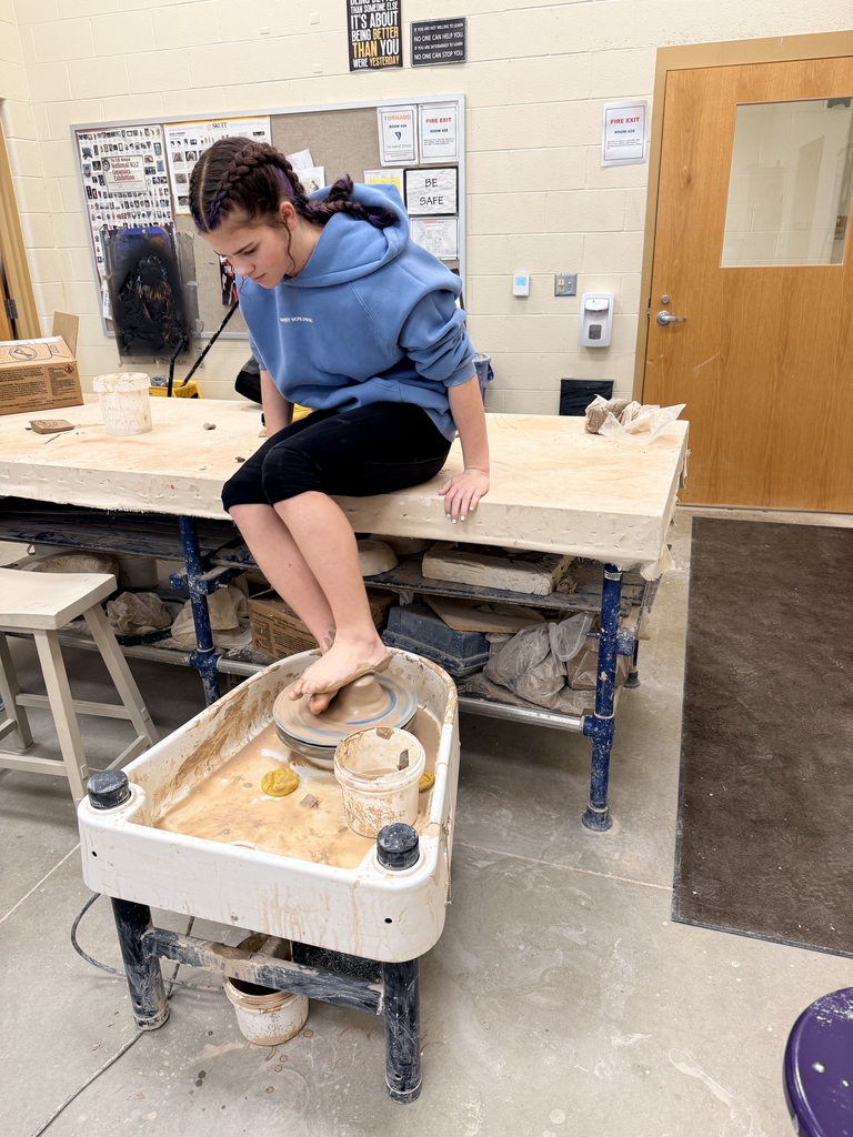 Rose Baxter throwing on a wheel with her feet