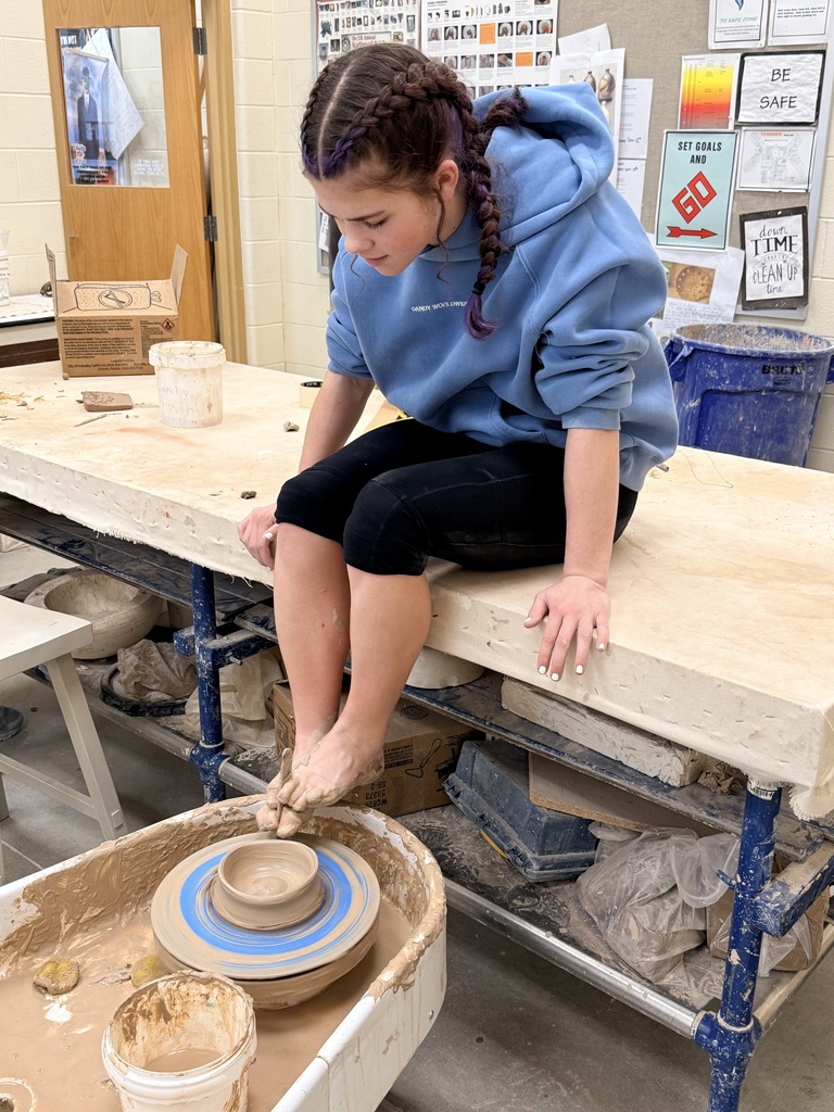 Rose Baxter throwing on a wheel with her feet