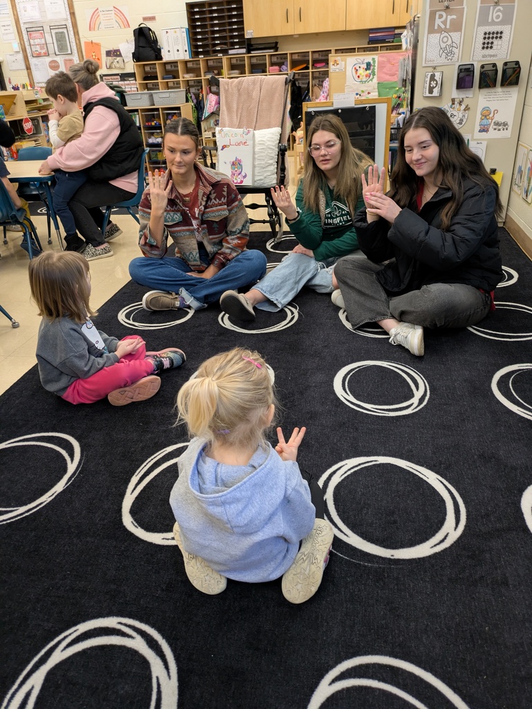 High Schoolers teaching ASL to Preschool students