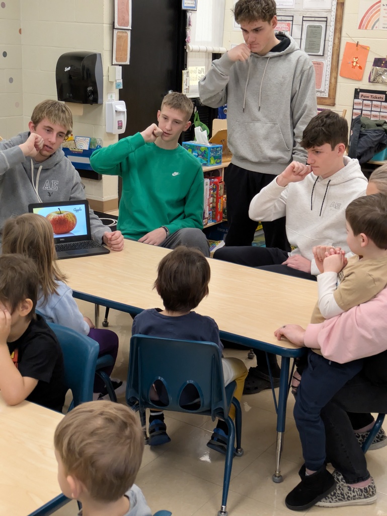 High Schoolers teaching ASL to Preschool students