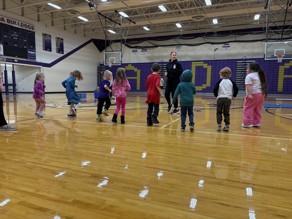 Mrs. Bass warming up with preschoolers