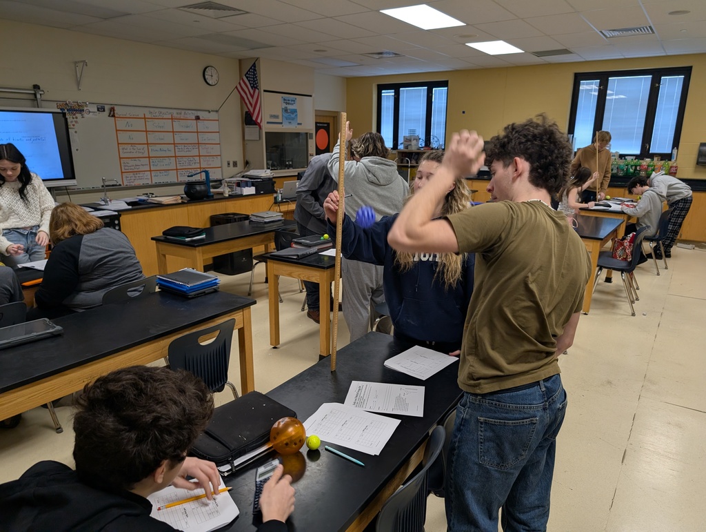 Students in Physical Science learning about kinetic energy