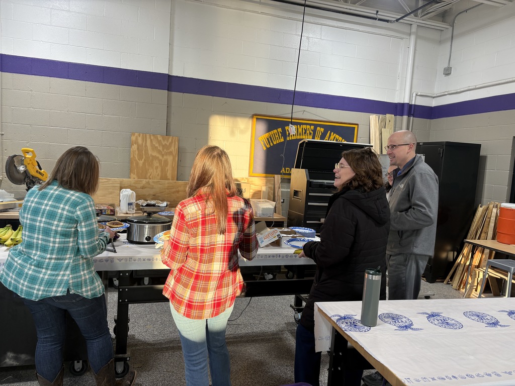 Teachers goiung through the breakfast buffet line
