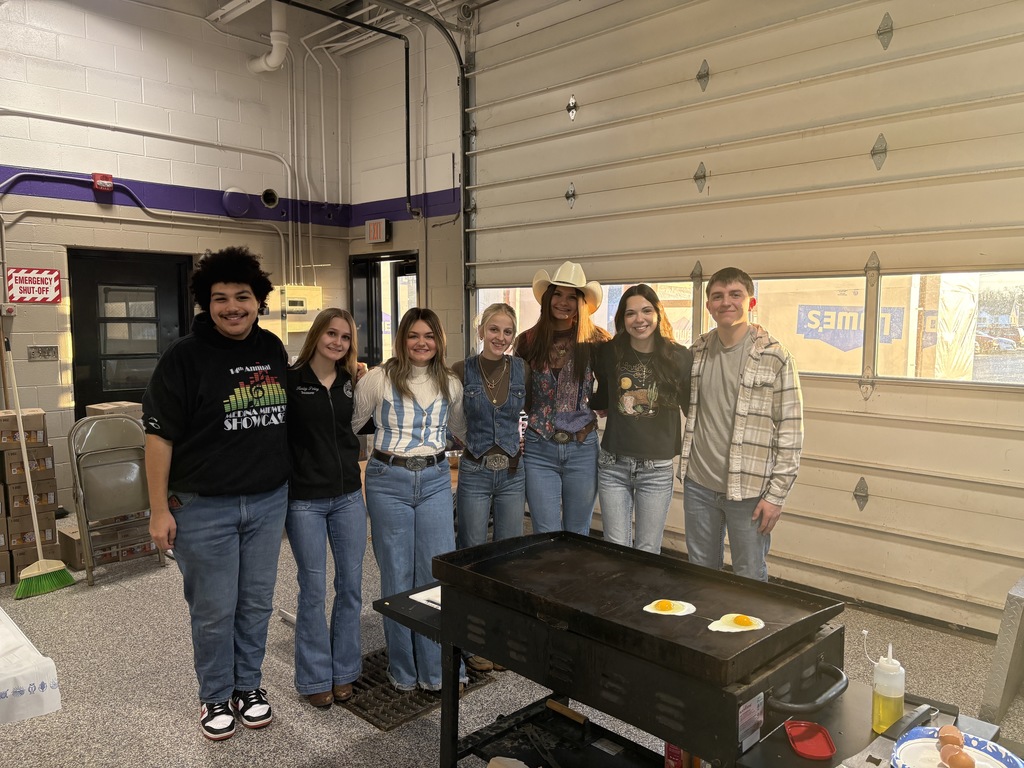 Ada FFA Officers standing over the griddle making breakfast
