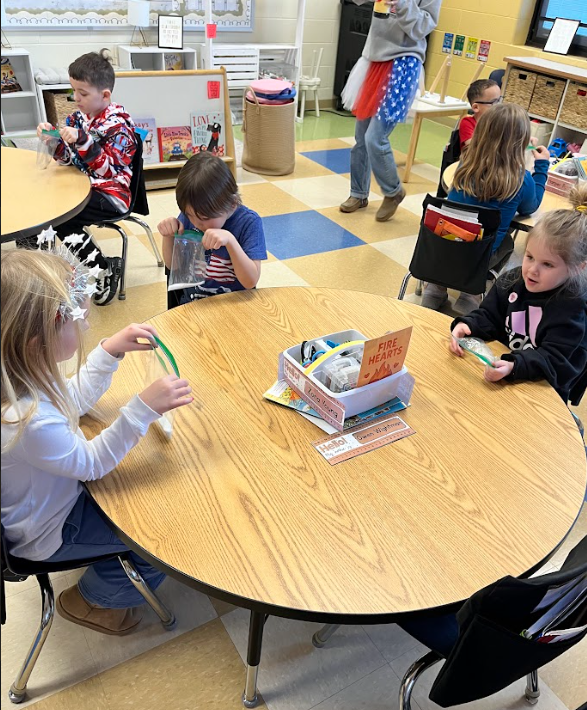 FFA students teaching kindergartners about cows and making ice cream