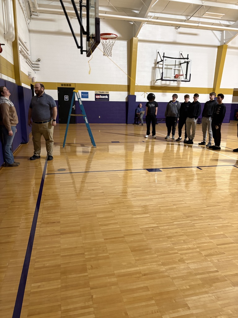 Physical Science Students  concept of conservation of energy with a hands-on bowling ball pendulum demonstration.