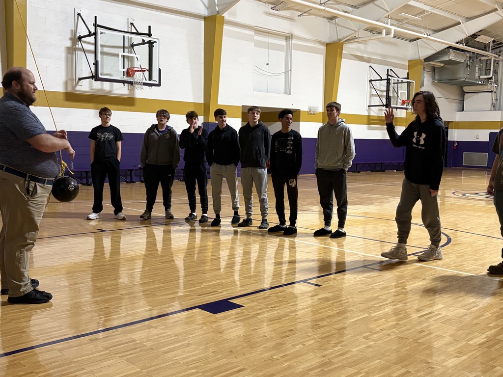 Physical Science Students  concept of conservation of energy with a hands-on bowling ball pendulum demonstration.