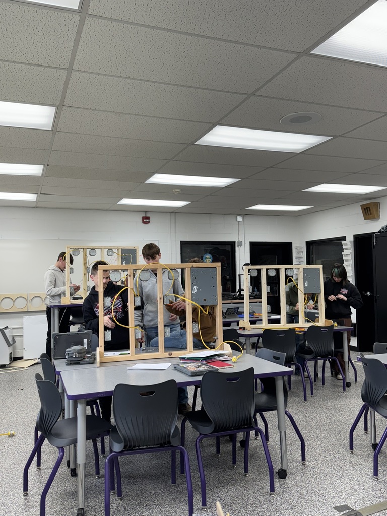 Students working on electric wiring 