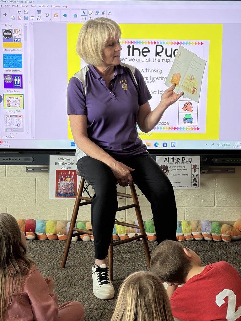 Mrs. Collins reading to students