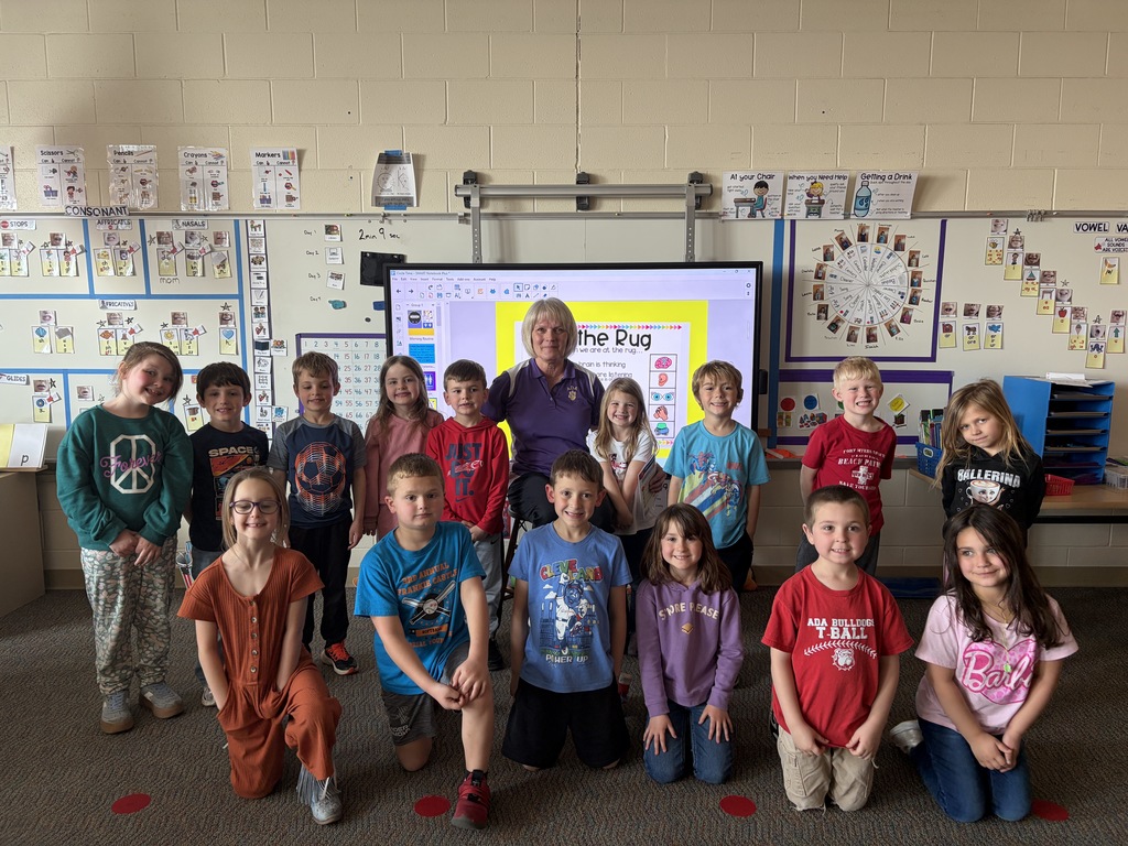 Mrs. Collins reading to students