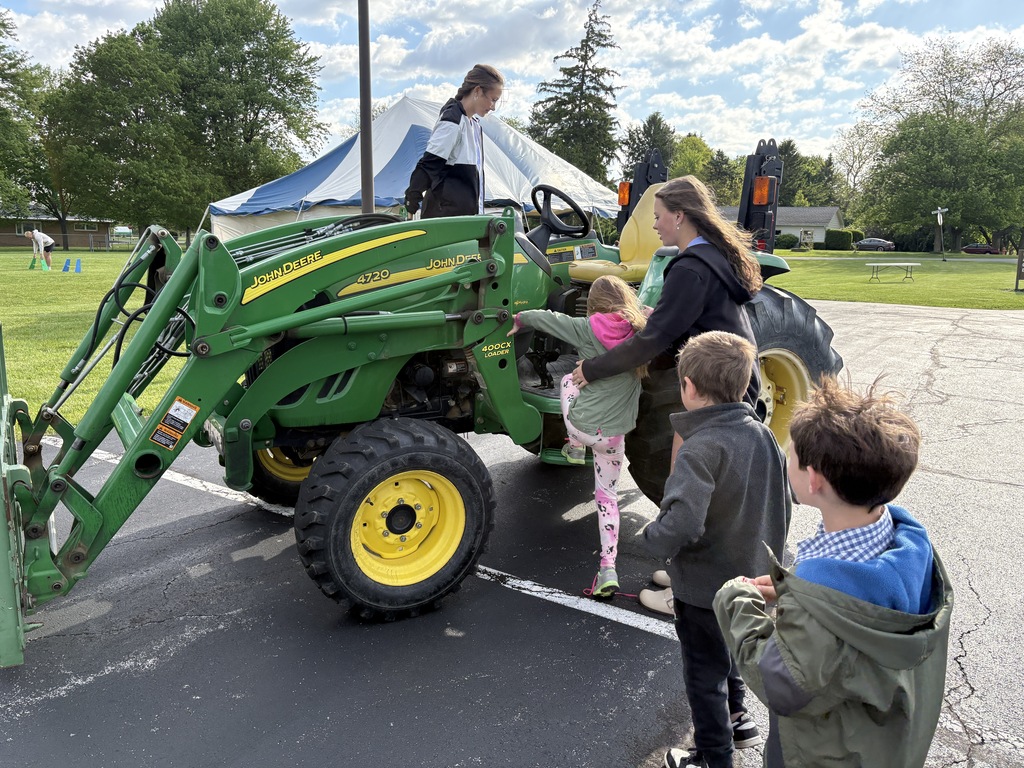 High School Students working with elementary students