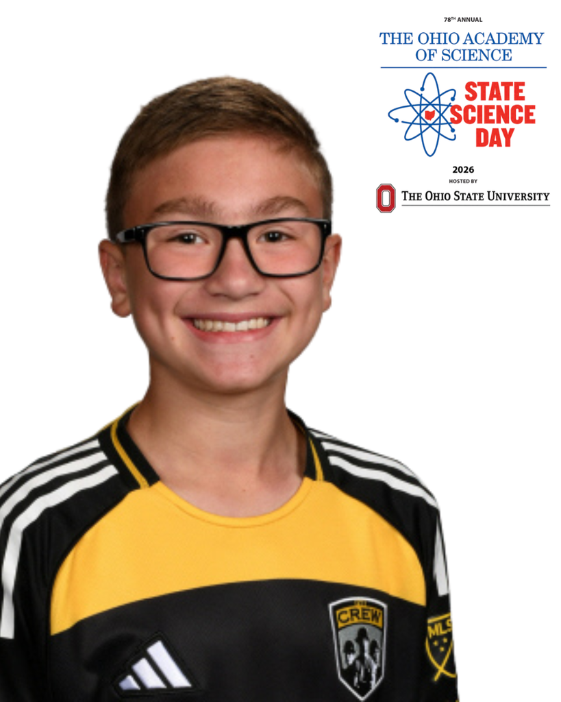 Student headshot in black and yellow shirt with glasses