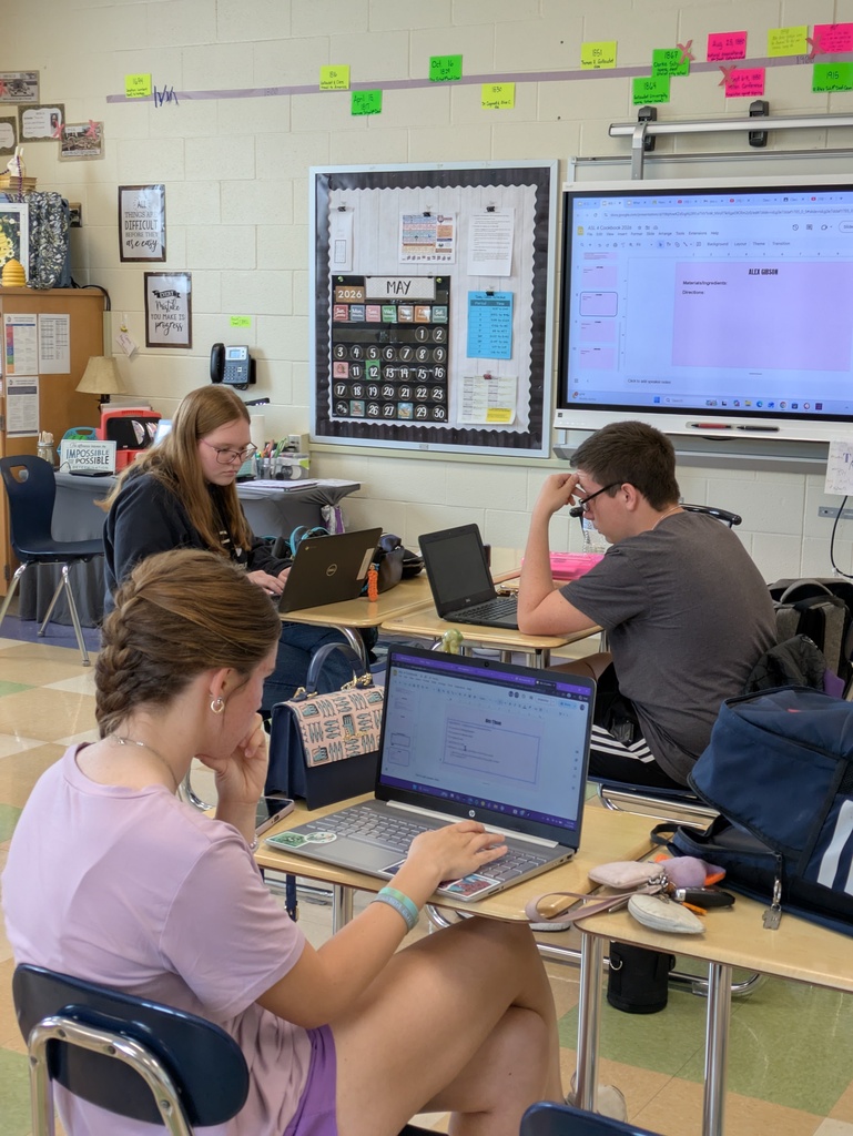 Students working on laptops sitting at desks