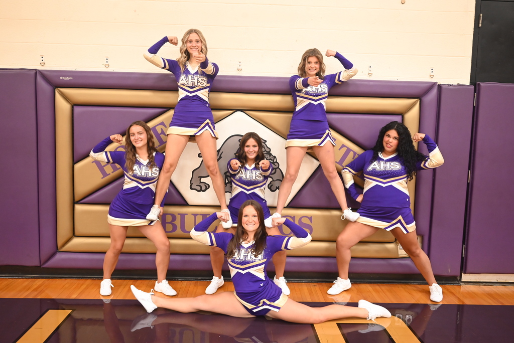 Six student cheerleaders standing in a formation