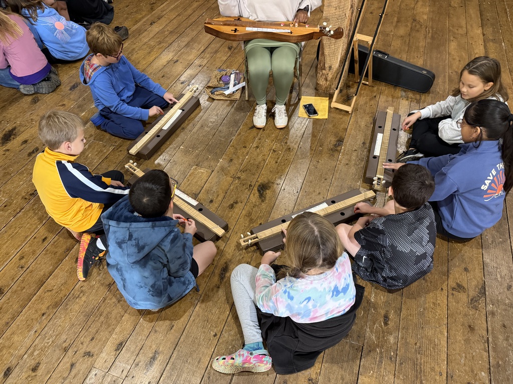 Students sitting around in a circle 