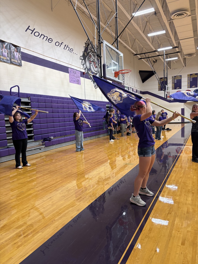 color guard doing a routine on the gym floor