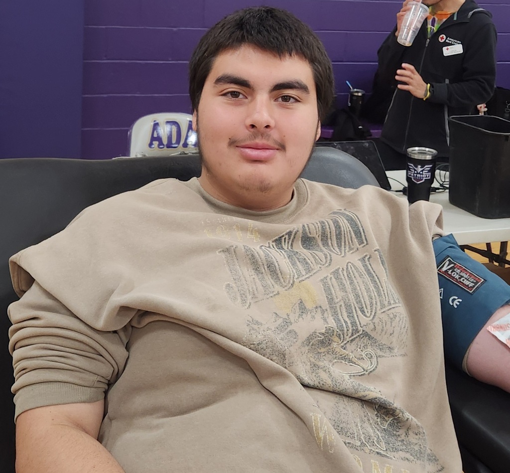 Student sitting with a blood pressue cuff on