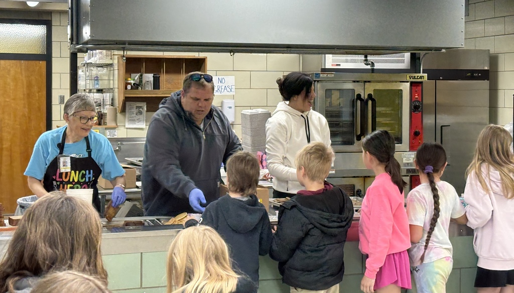 Board members serving breakfast