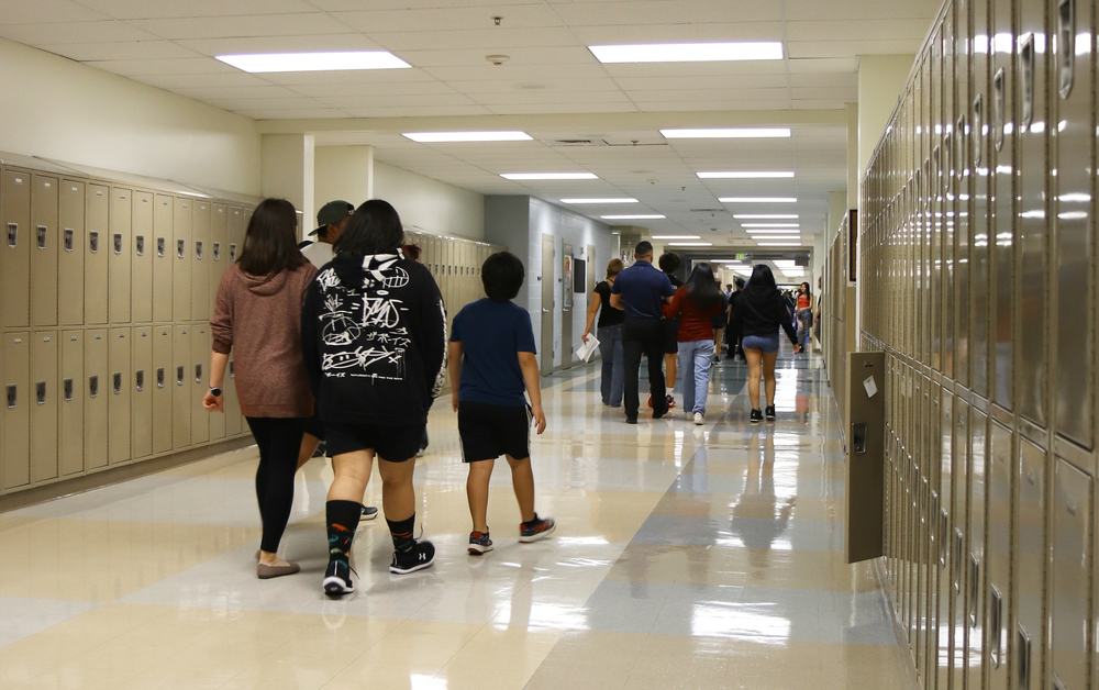 Kids walking down a school hallway