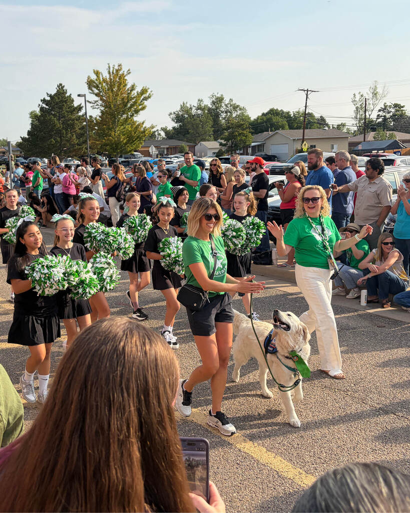 Hulstrom welcome parade with principal, cheerleaders and a dog
