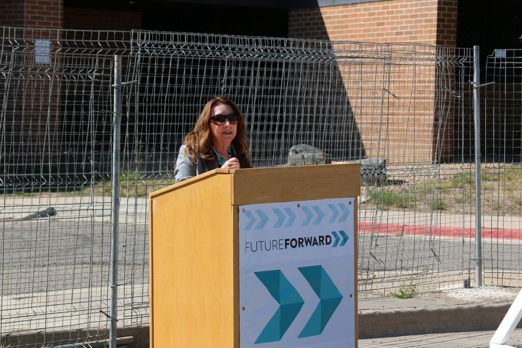 Principal speaking at podium