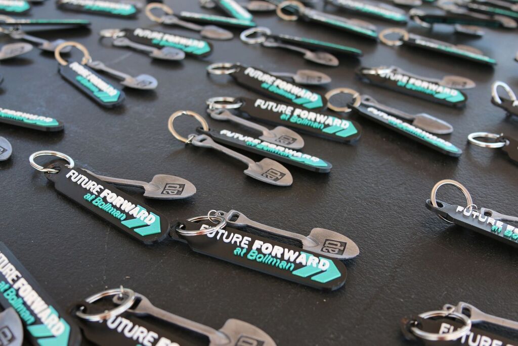 Keychains that read FutureForward at Bollman with small shovels