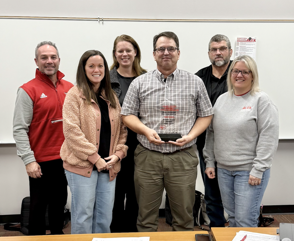 Photo of Mike Brown and school board members.