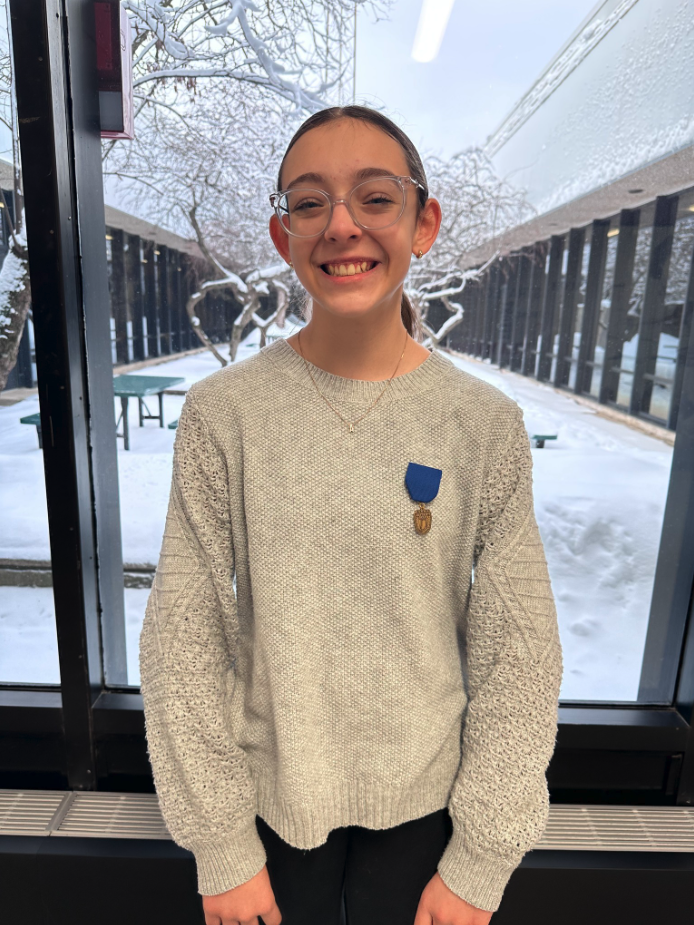 Student  wearing  ISSMA medal.