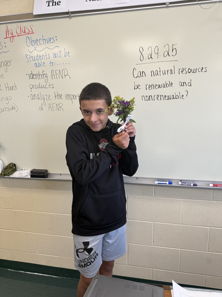 Student holding a bouquet