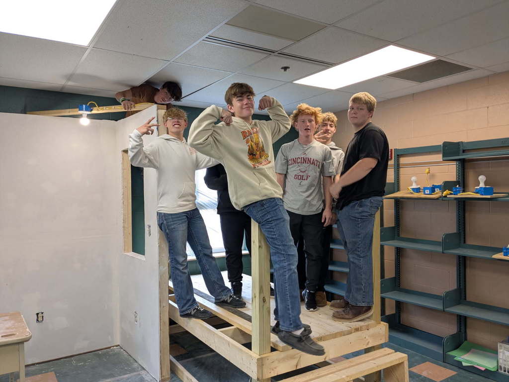 Fixer Upper students standing on the deck that they constructed