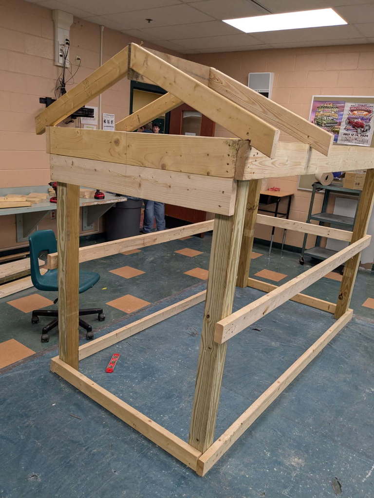 Pole barn with rafters constructed by the fixer upper class