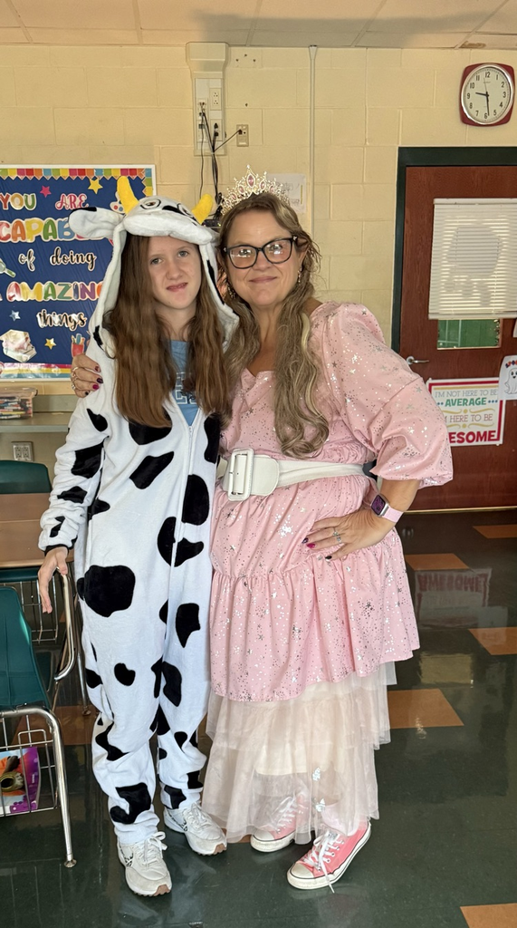 A cow with Glenda the Good Witch