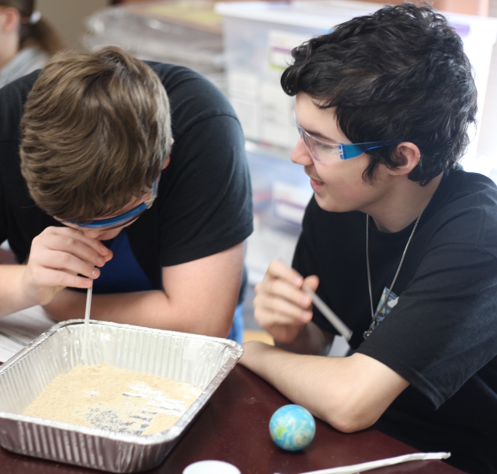 Students investigating wind erosion.