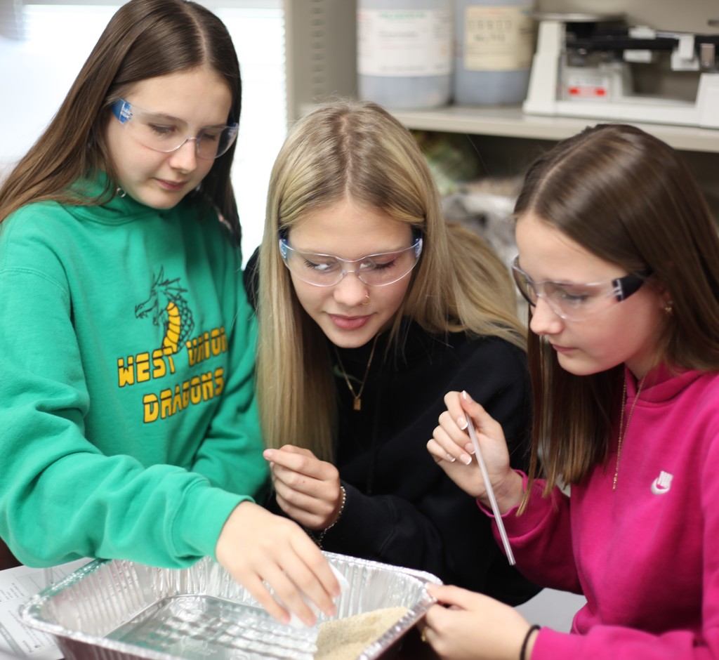 Students investigating wind erosion.