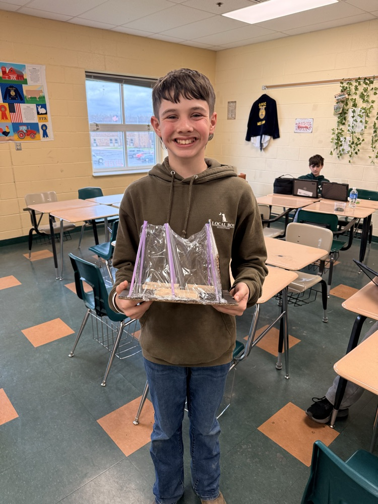 Student holding his landscape project.