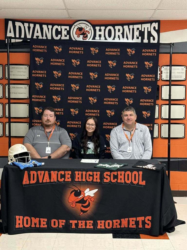 Brogan Hawkins and Mr. Hamlin, AD, and Mr. Roberts, HS Principal