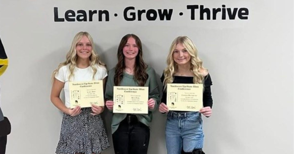 udree Dorn, Reese Polk, and Cameryn Winterland show Girls Basketball All-Conference Award certificates