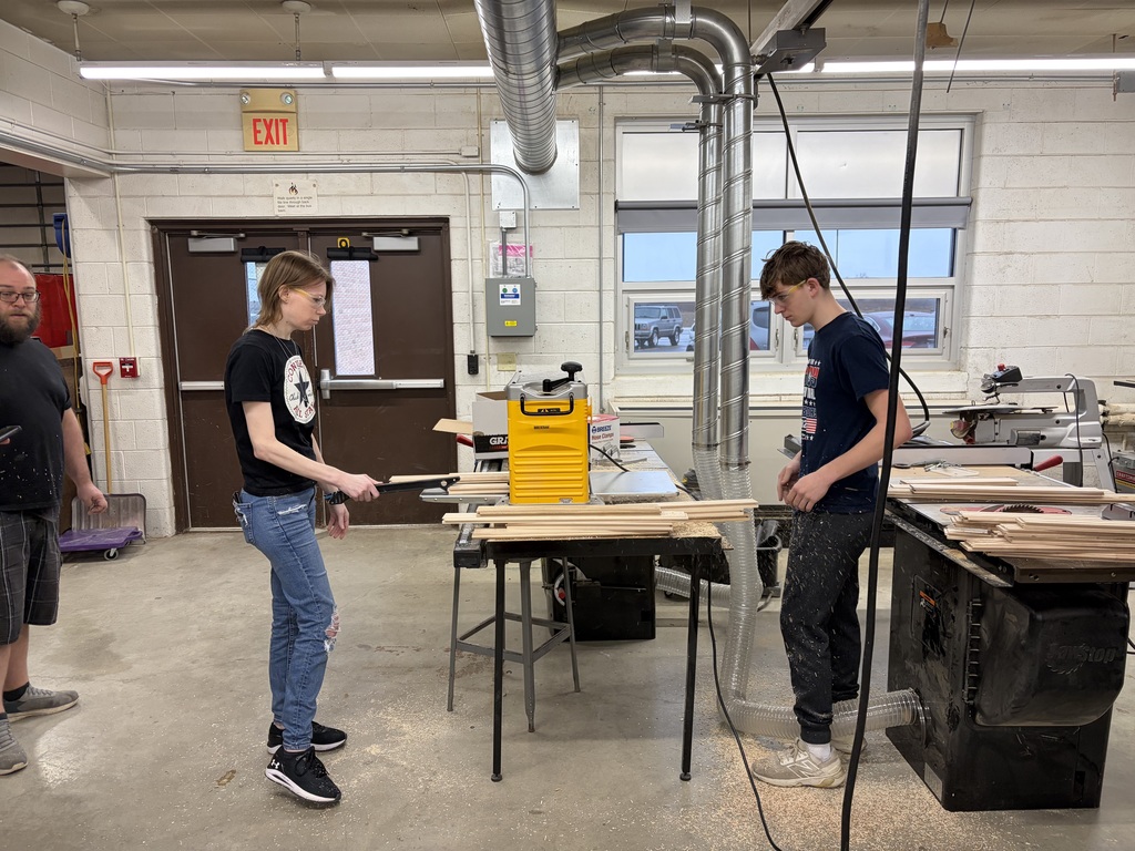 two students working in the workshop