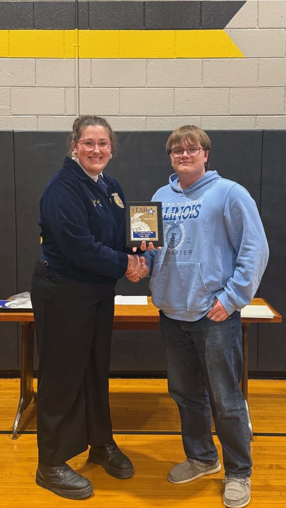 Teacher giving award to student