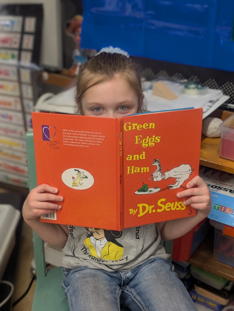 Student reading green eggs and ham
