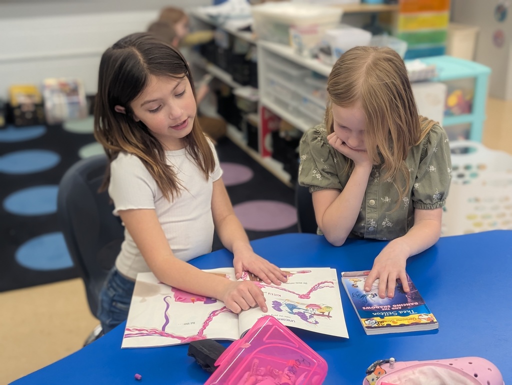 female students reading together