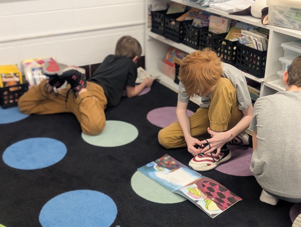 several students reading on the floor